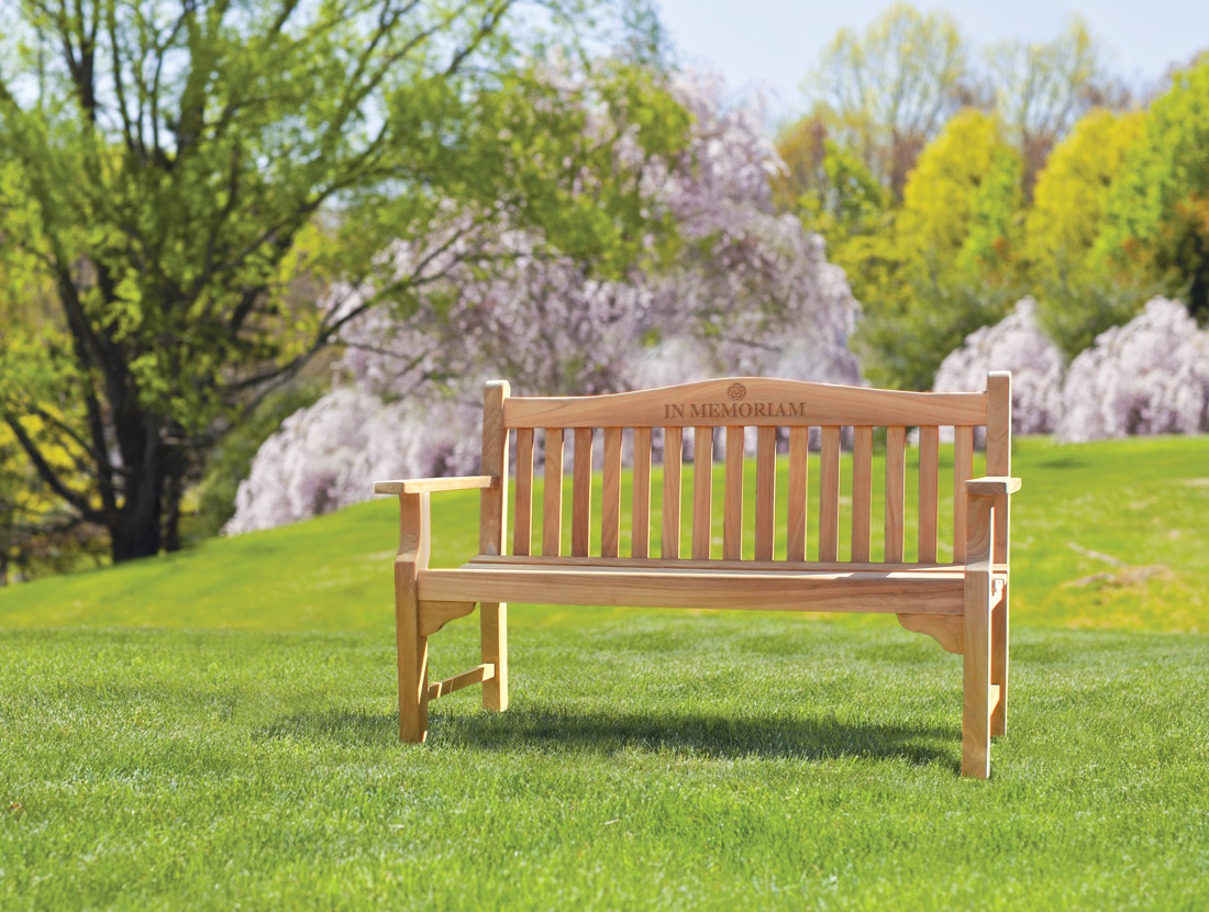 teak memorial bench in park setting.jpg
